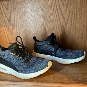 Used pair of colorful Nike tennis shoes